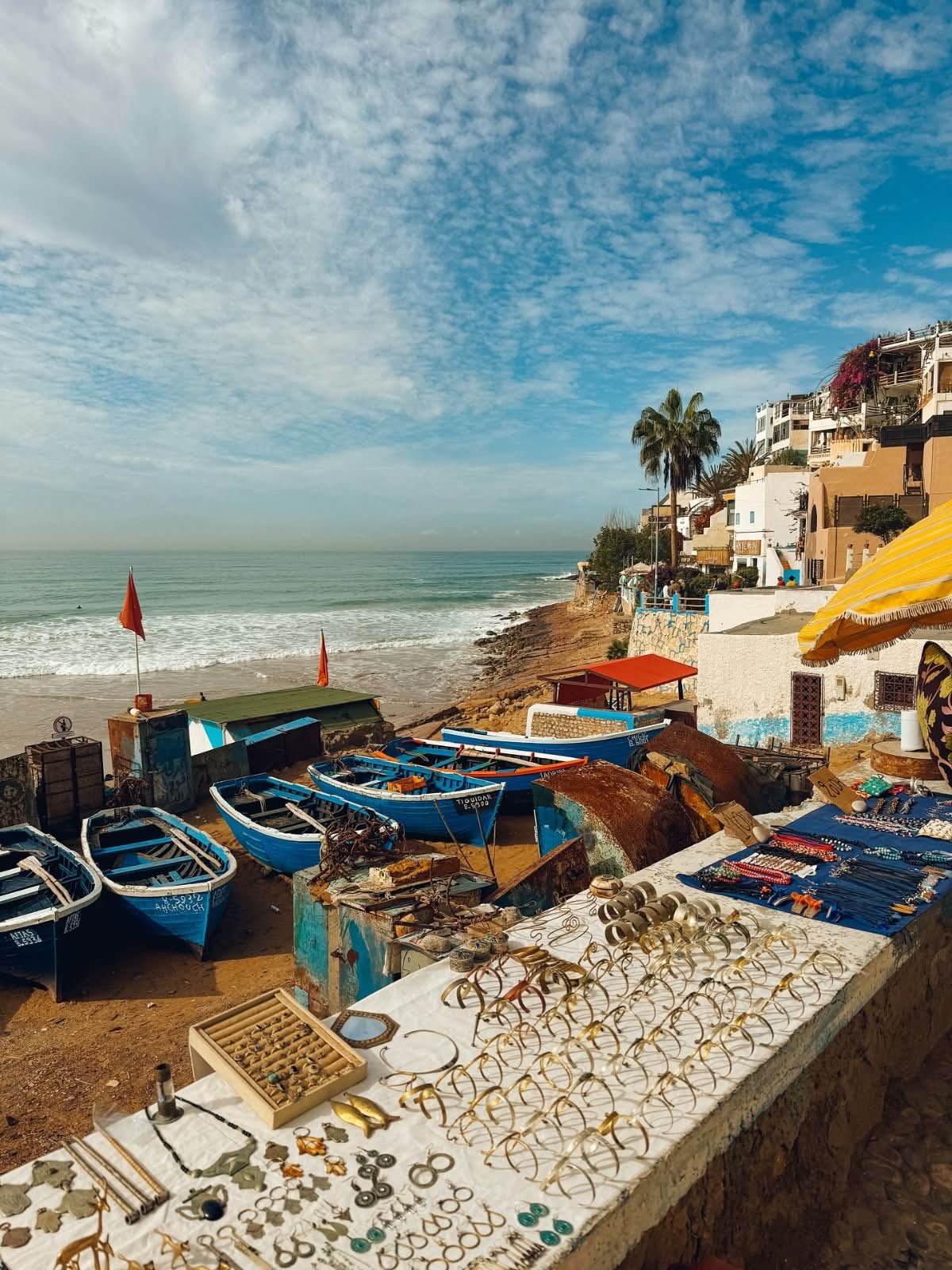 Taghazout coast with fishing boats and seaside buildings